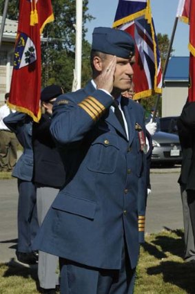 Russell Williams salutes as he arrives at the Battle of Britain parade in Trenton, Ontario, in September last year.