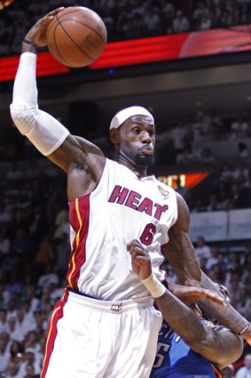 LeBron James prepares to dunk over an Oklohome City opponent.