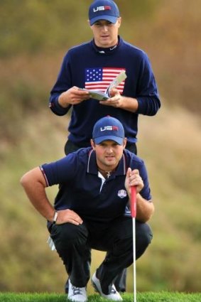 Jordan Spieth  (back) and teammate Patrick Reed scored the only points for the US in the afternoon session.