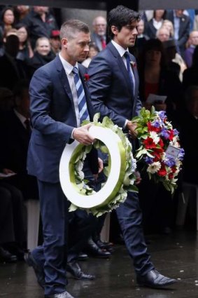 Michael Clarke and Alastair Cook prepare to lay wreaths during a Remembrance Day ceremony in Sydney on Monday.