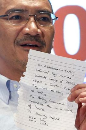 New lead: The note handed to Malaysia's acting Transport Minister regarding the new satellite images. The dimension of debris were incorrect in the note and are now reportedly 22.5 metres long and 13 metres wide.