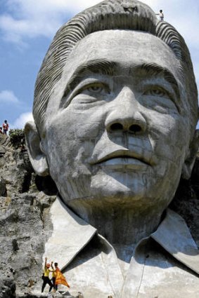 Rock and rolled … a Mount Rushmore-like sculpture of Ferdinand Marcos at Marcos Park in Pugo, before it was destroyed in 2002 by persons unknown.