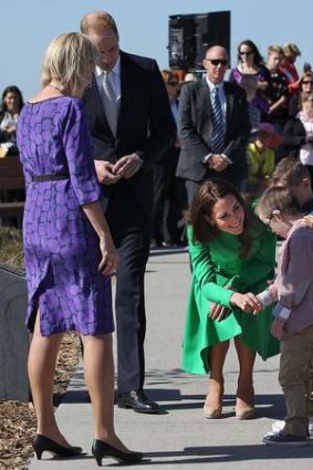 Royal encounter: Catherine, Duchess of Cambridge, greets twin brothers Oliver and Sebastian Lye, at the National Arboretum in Canberra.