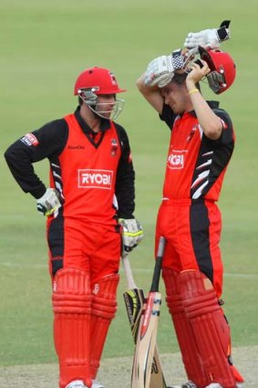 Phillip Hughes (left) has a chat with Michael Klinger during a one-day game between the Redbacks and the Tasmanian Tigers.