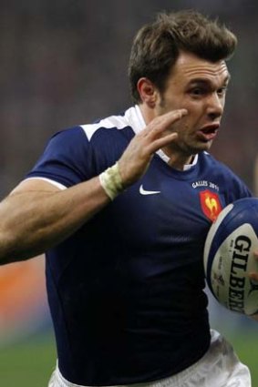 France's Vincent Clerc breaks cleart to score a try.