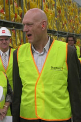 Battman ... Federal Environment Minister Peter Garrett receives a tour of the Bradford insulation plant in Brisbane today.