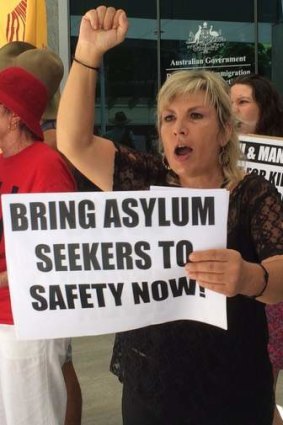 Julie Mauger protests outside the Department of Immigration's Brisbane office.