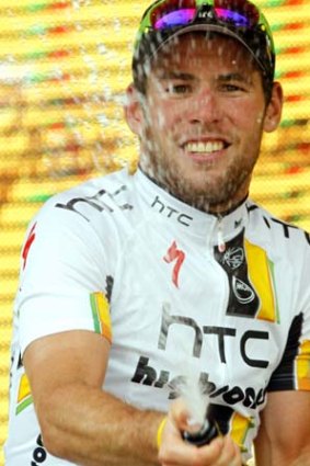 Mark Cavendish of Britain celebrates on the podium after winning the 10th stage of Giro D'Italia.