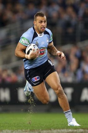 Out of sight: Blake Ferguson on the charge in Origin I.
