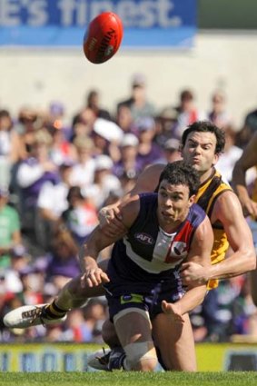Fremantle's Ryan Crowley is tackled by Hawthorn's Jordan Lewis during Fremantle's finals win over Hawthorn in 2010.