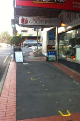 Scene of the crash: an out-of-control ute crossed two lanes of traffic, mounted the gutter, struck a street sign and a pizza shop before crashing into Richard Warburton.