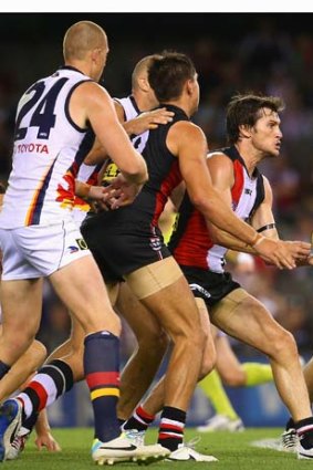 Farren Ray of the Saints handballs during the match against the Adelaide Crows.