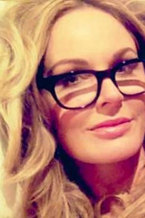 Charlotte Dawson opts for the accessory of the moment, stylish spectacles, with her bouncy hair.