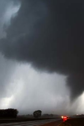 A tornado makes its way over the 135 freeway near Moundridge, Kansas.