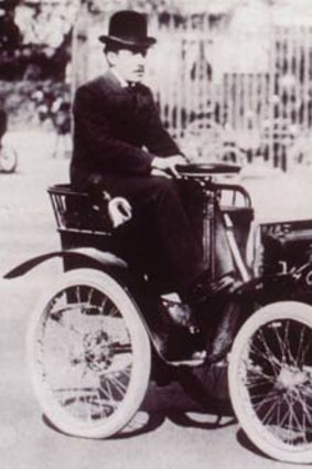 Entrepreneur ... Renault drives a miniature car in 1899.