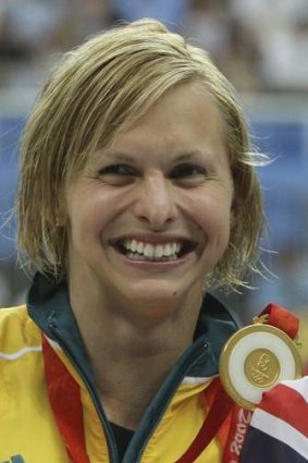 Libby Trickett with her gold medal  after winning the women's 100m butterfly final at the 2008 Beijing Olympics.
