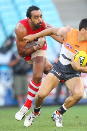 Dylan Shiel (right) takes on Adam Goodes during the round two game between the Giants and the Swans on Saturday.