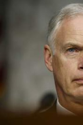 Ron Johnson listens to Secretary of State Hillary Clinton respond to questions about the September attack in Benghazi.