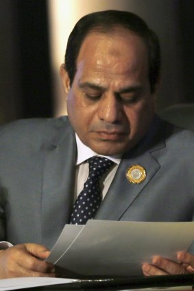 Egyptian President Abdel Fattah al-Sisi reads at the Arab Summit in Sharm el-Sheikh on Sunday. 