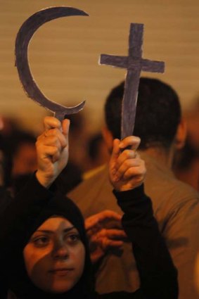 An Egyptian Muslim in the Shobra district of Cairo protests on New Year's Day against a bomb attack on a Coptic church in Alexandria.