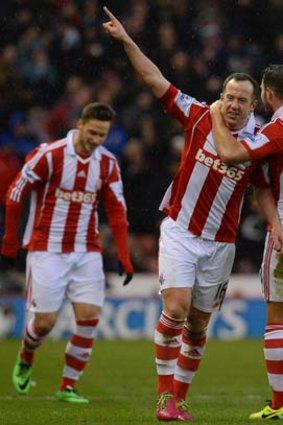Stoke City midfielder Charlie Adam (C) celebrates after scoring his team's second goal against Manchester United on Saturday.