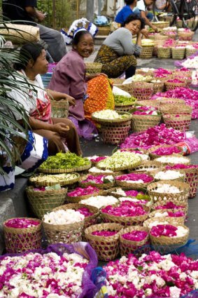 Flower sellers at a street-side market in Yogyakarta.