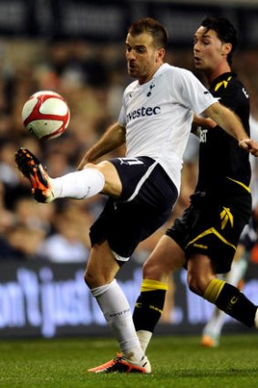 Rafael Van Der Vaart of Spurs controls the ball as Chris Eagles of Bolton closes in.