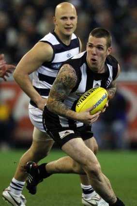 Dane Swan gets a break on Gary Ablett during the preliminary final.
