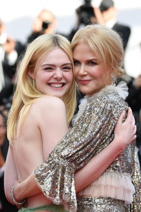 Actresses Elle Fanning and Nicole Kidman depart after the "How To Talk To Girls At Parties" screening.