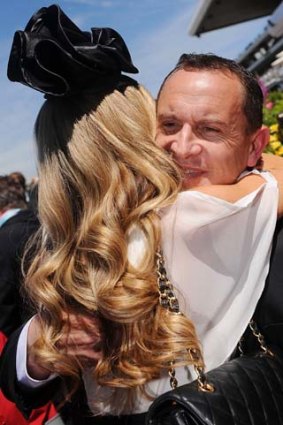 Trainer Chris Waller is congratulated by wife Stephanie.