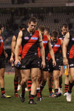 The Bombers trudge off the field after losing to Hawthorn in round 18 of last year.