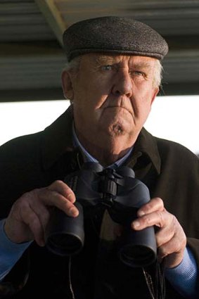 Bill Hunter as horse trainer> Bart Cummings in <i/>The Cup</i>.