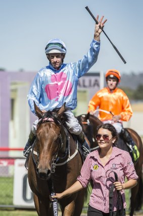 Jockey Hugh Bowman on Snippets Land acknowledges the crowd after winning the Canberra National Sprint.