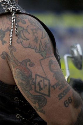 A member of a bikie group going past a police check.