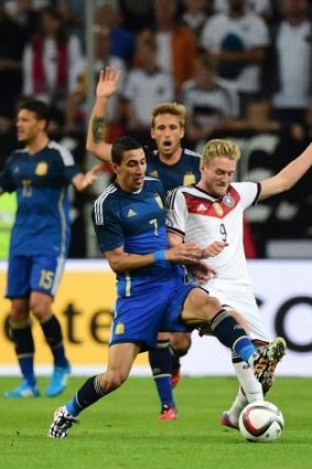 Germany's forward Andre Schuerrle (R) vies with Argentina's midfielder Angel Di Maria.