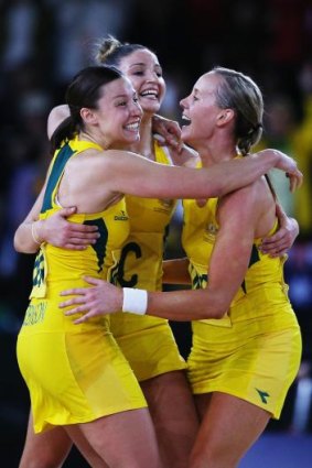 Madi Robinson, Kimberley Ravaillion and Renae Hallinan celebrate after Australia took out the Commonwealth Games gold medal. 