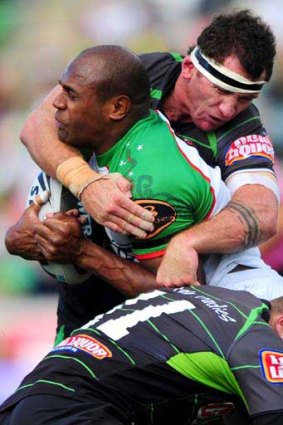 Bunny hug . . . Souths' Rhys Wesser, scorer of the winning try in the 68th minute, is wrapped up by Raiders Trevor Thurling and Josh Miller.