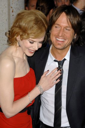 The man with the golden fingers, Keith Urban and wife, Nicole Kidman.