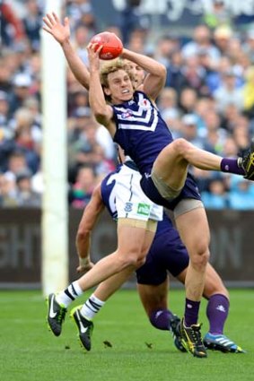 Competitor: Mayne marks against Geelong in week one of the finals.