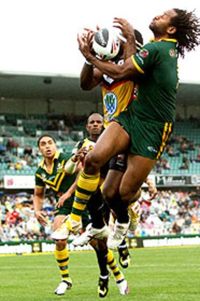 Kangaroo Lote Tuqiri contests a high ball.
