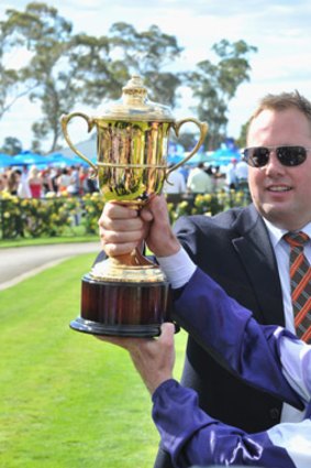 Owner Nick Williams and jockey Steven King with trophy after Tanby won the Bendigo Cup last year.