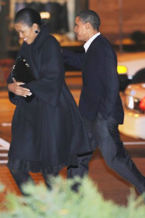 US President-elect Barack Obama and his wife Michelle leave Spiaggia restaurant after dininer in Chicago.