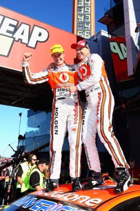 Mountain heroes: Jamie Whincup and Paul Dumbrell celebrate their win at Bathurst.