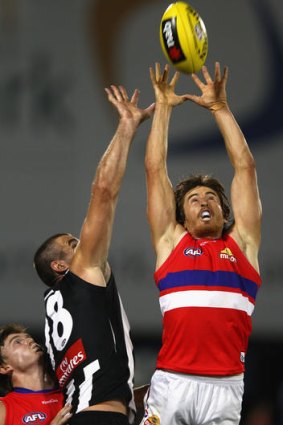 Tall timber: Dylan Addison marks over Darren Jolly.