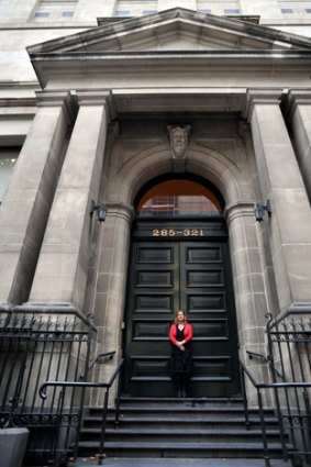 Sue Roberts pictured in front of the State Library's Russell Street frontage, which she wants to reopen.