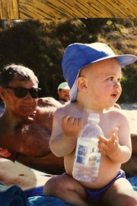 At the beach years ago with his grandson.