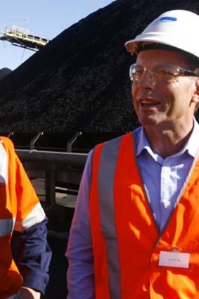 Carbon tax fight ... Tony Abbott tours a Hunter Valley coalmine yesterday.