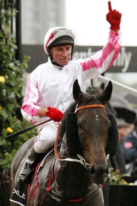Jockey Jim Cassidy celebrates after he rode Maluckyday to victory in the Lexus Stakes.