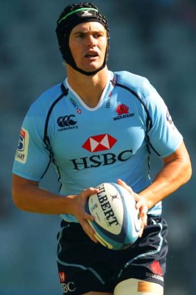 Shaping to kick. But far too often for the Waratahs' fans ... Berrick Barnes.