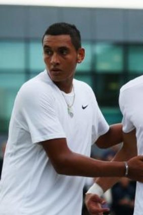  Nick Kyrgios shakes hands with Jiri Vesely of the Czech Republic after their singles match.